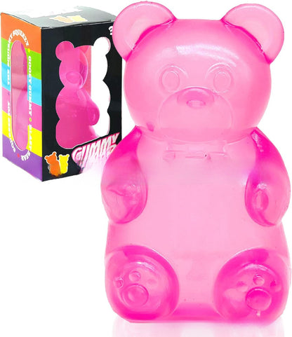 Pink gummy bear-shaped container with packaging in the background